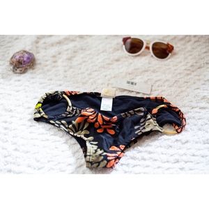 L-Space swimsuit bottom with gold metal hoop rings